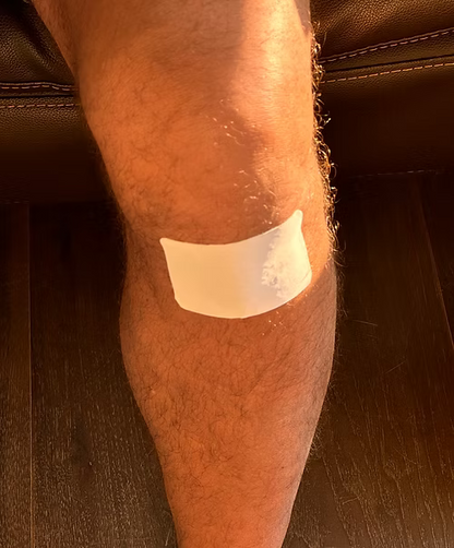 VIA PIEL wellness patch on a men's knee.